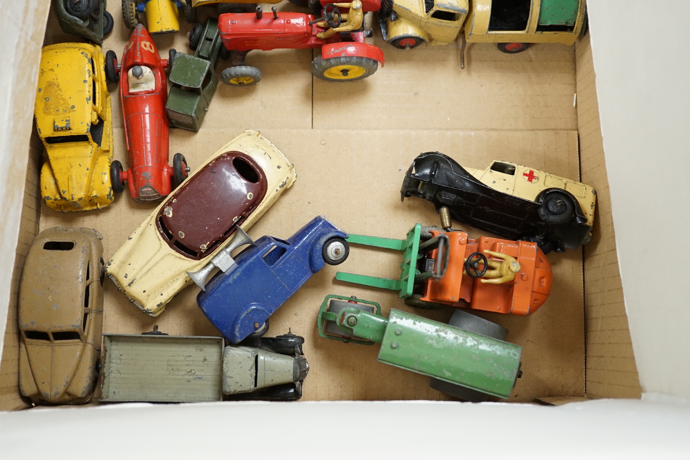 Twenty Dinky toys for restoration, including a Hudson Sedan, Loudspeaker van, Double deck Bus, Vanguard, etc. together with a Marx tinplate tractor crawler and a Tri-ang Minic caravan
